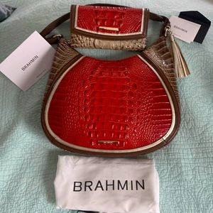 Red and brown Brahmin handbag with matching wallet.